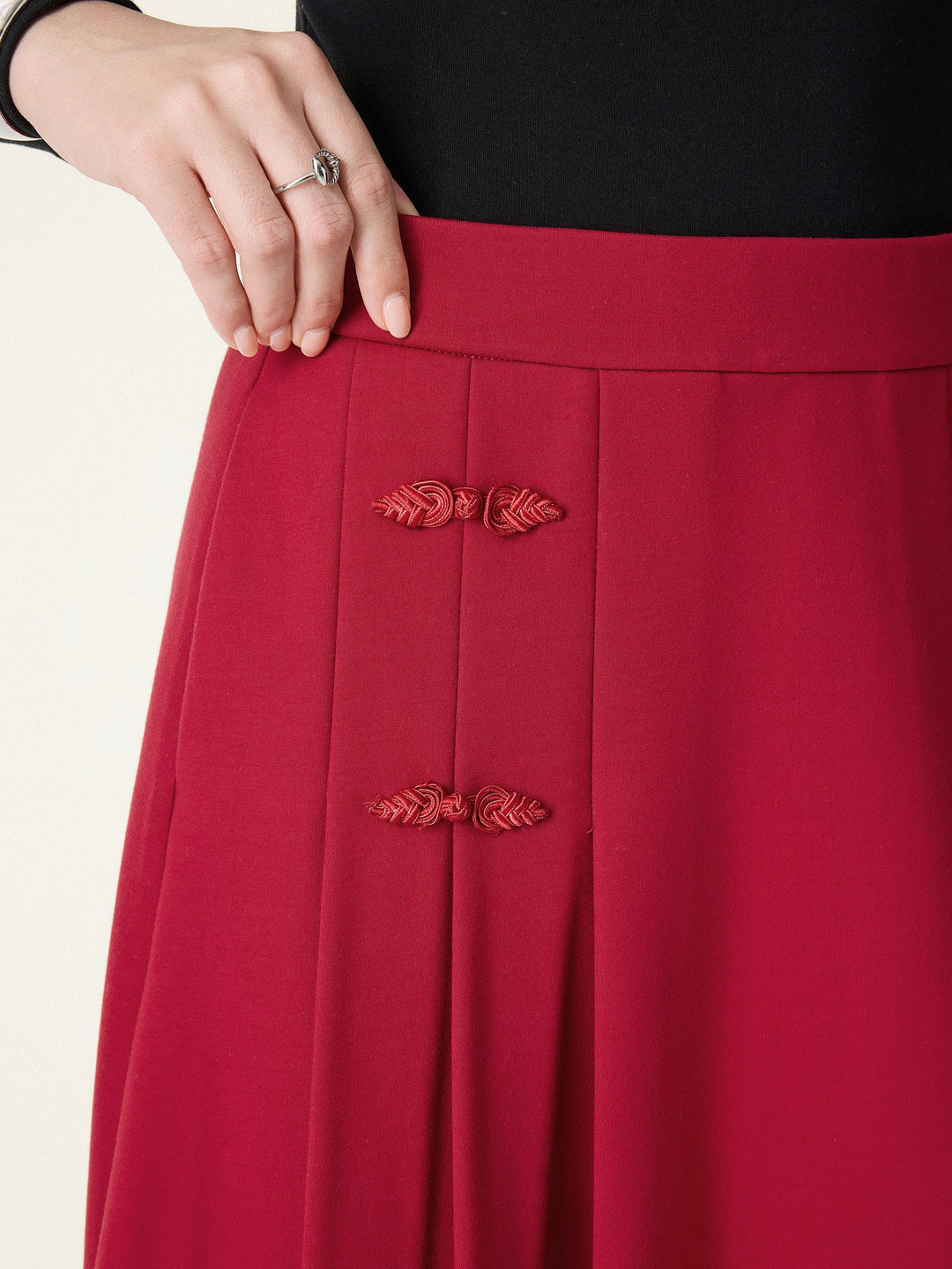 NORELLA | Pleated Midi A-Line Skirt with Frog Button Detail
